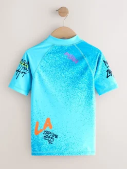 Blauw met graffitiprint - Surfhemdje (1,5 - 16 jr)