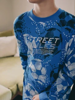 Blauw/zwart met voetbal - Verpakking van 2 pyjama's met lange mouwen (3-16 jr)