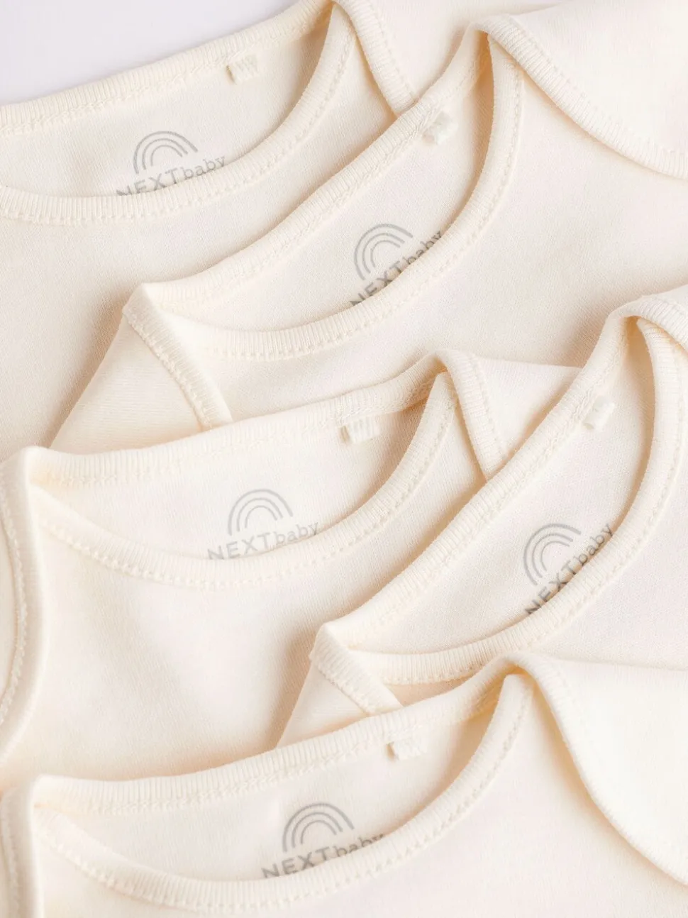 Crème - 5 Must-have rompertjes met korte mouwen