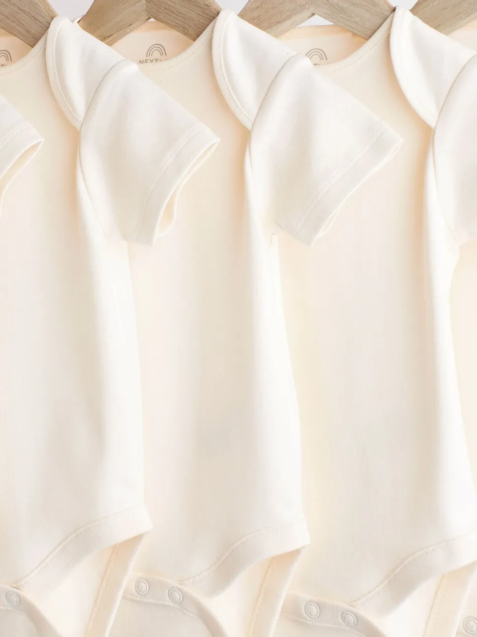 Crème - 5 Must-have rompertjes met korte mouwen