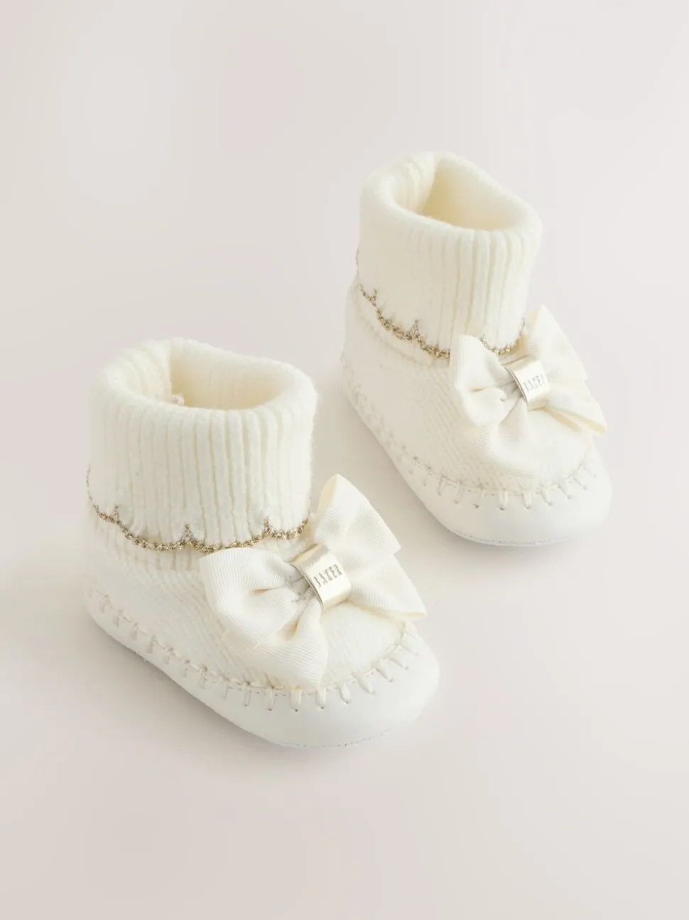 Crème - Gebreide padderslaarsjes met geschulpte rand voor babymeisjes met strik