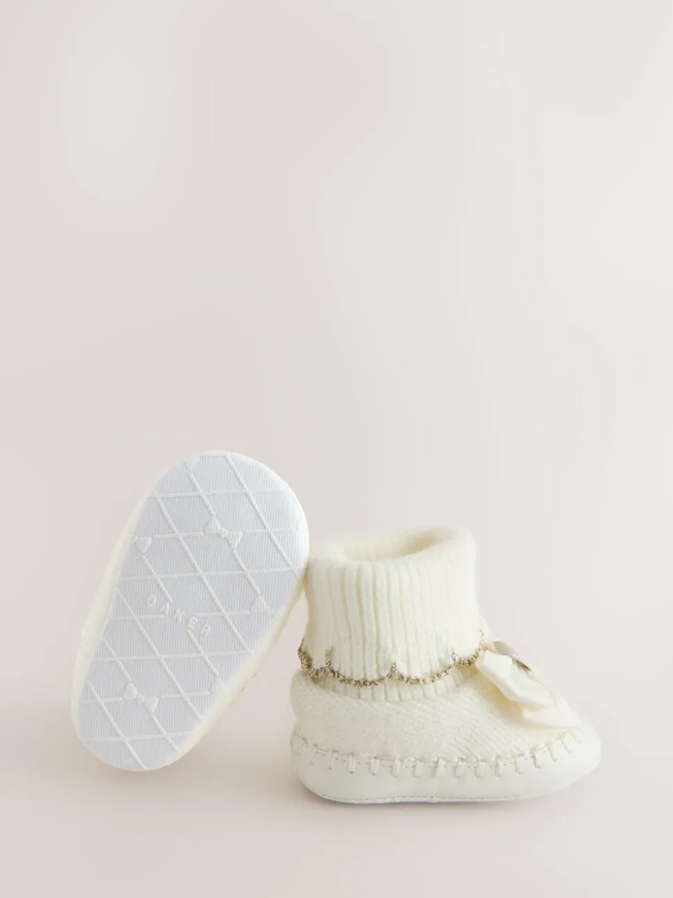 Crème - Gebreide padderslaarsjes met geschulpte rand voor babymeisjes met strik