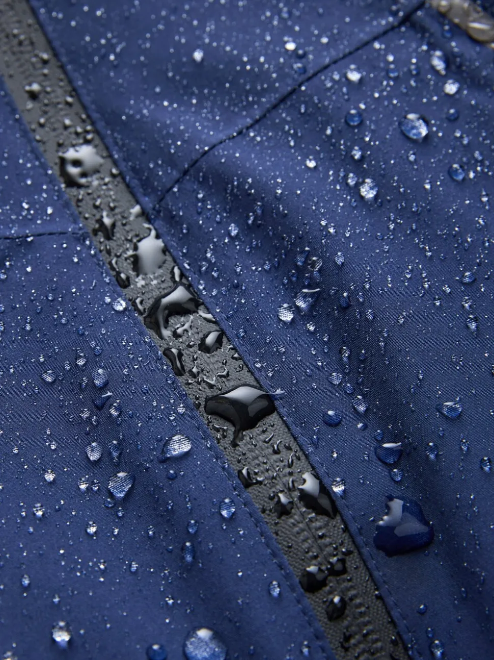 Donkerblauw - Waterdichte jas met fleece voering en capuchon (3-17jr)