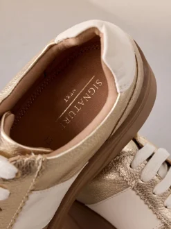 Goud - Signature premium leren sneakers met veters en grove sleehak
