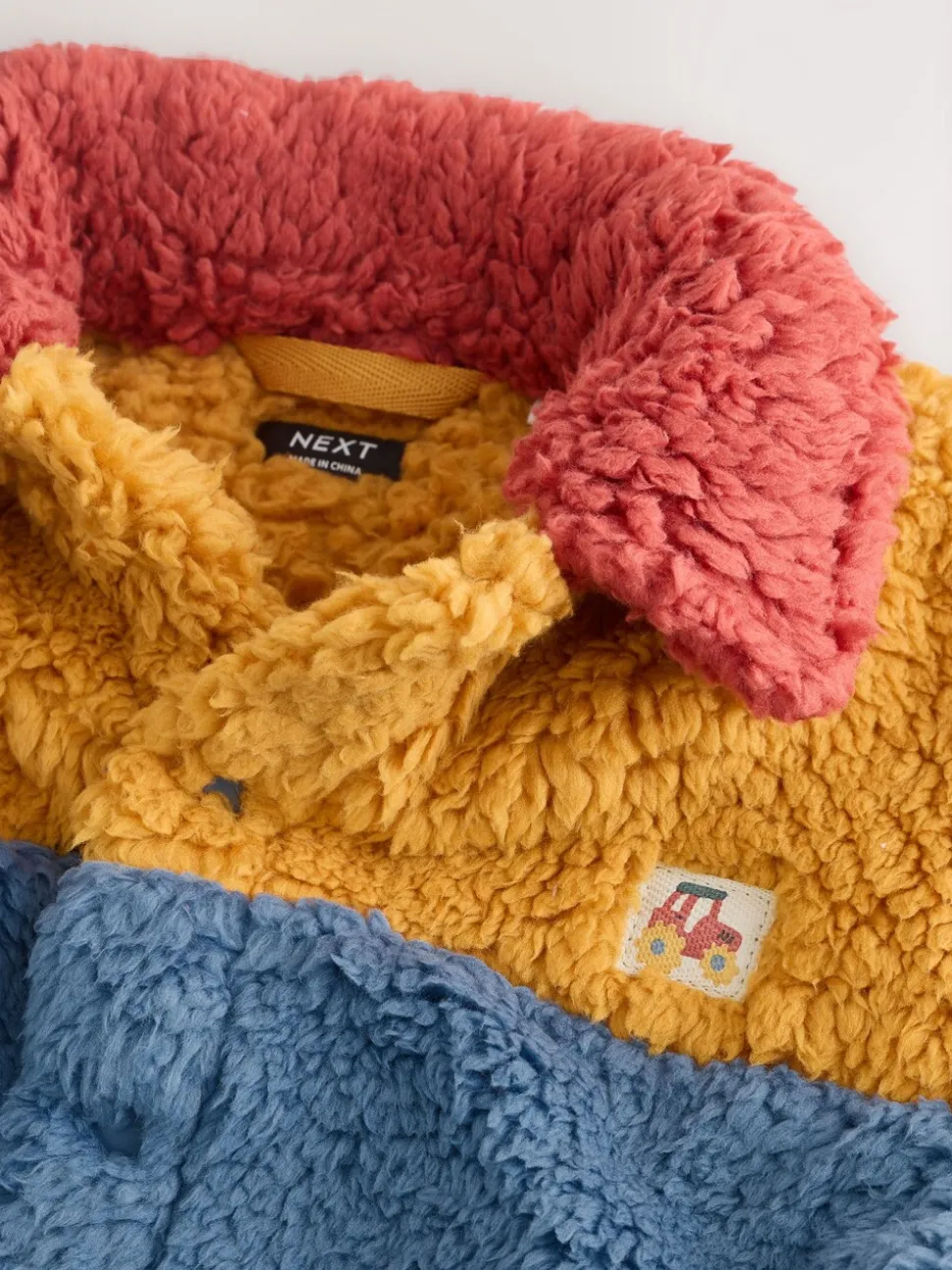 Helder blauw/geel kleurblok - Fleece shacket van borg (3 mnd - 7 jr)