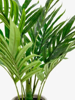 Kleine Kentia-kunstpalmplant in geribbelde betonnen pot