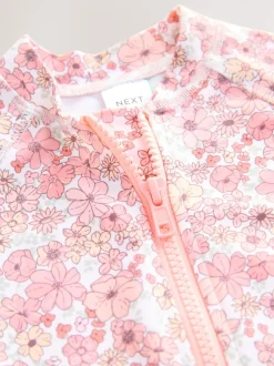 Koraalroze met fijne bloemenprint - Zonbeschermend badpak met lange pijpen (3 mnd-7 jr)