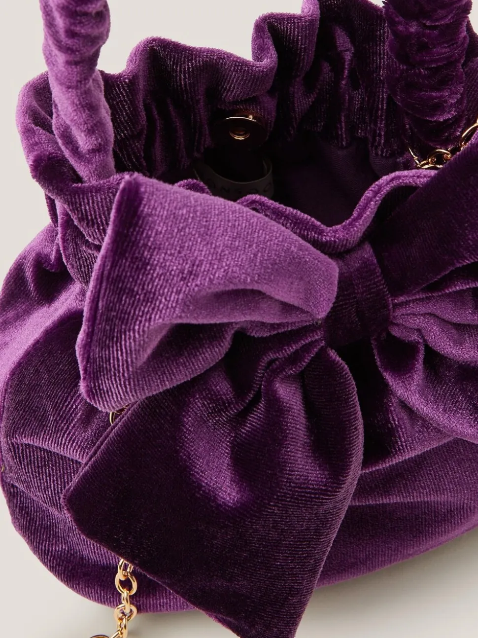 Monsoon Bow Velvet Pouch Bag