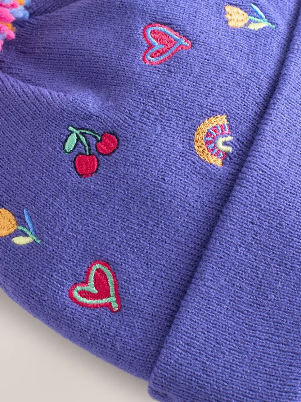 Multi - Geborduurde Beanie-muts met pompon (3mnd-10jr)