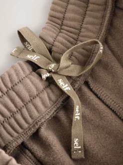 Nertsgrijs/bruin - self. joggingbroek met wijde pijpen