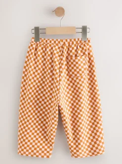Oranje met dambordmotief - Broek met wijde kortere pijpen (3mnd -7jr)