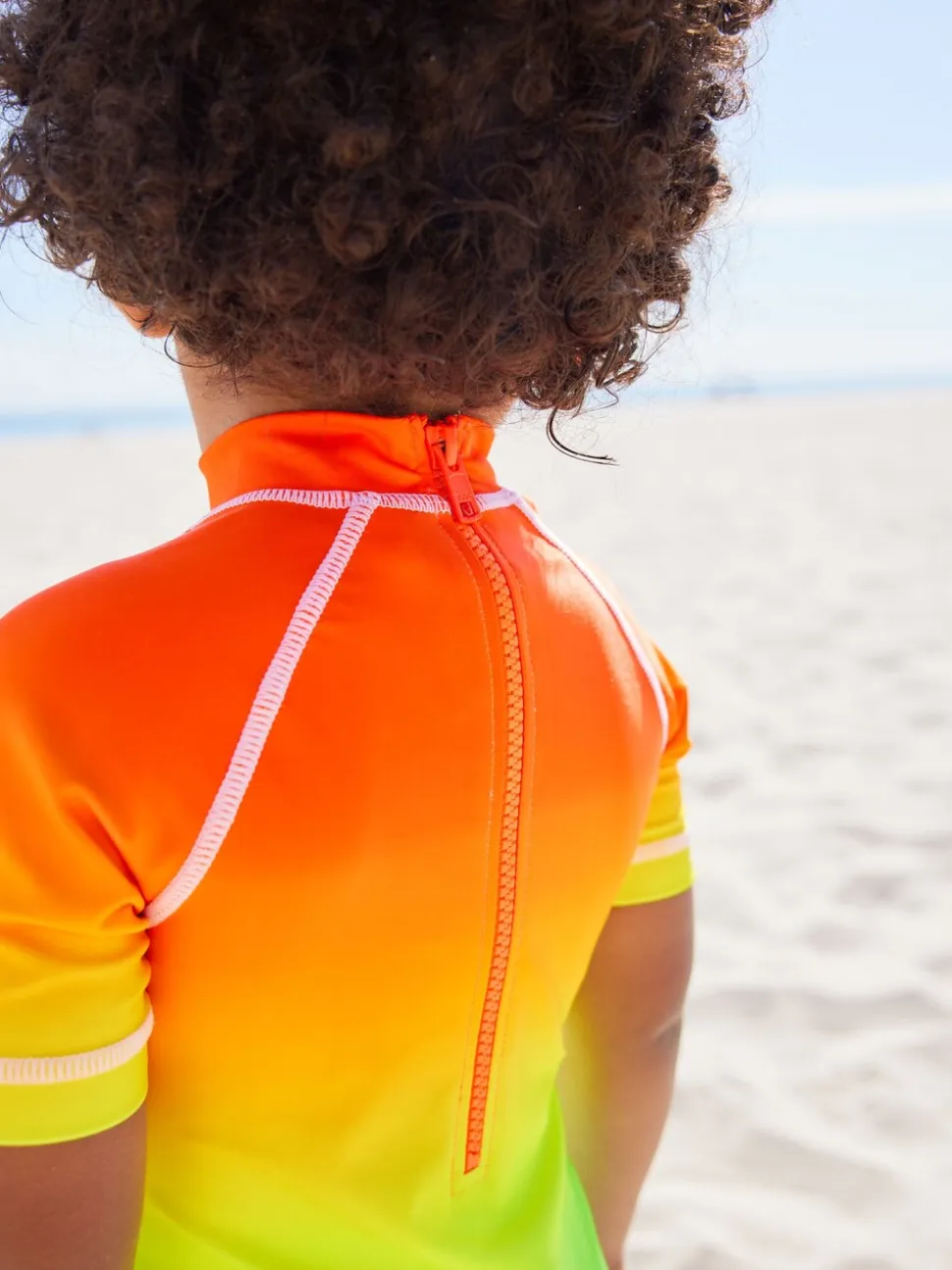 Regenboog dip-dye - Zonbeschermend onesie (3 mnd-7 jr)