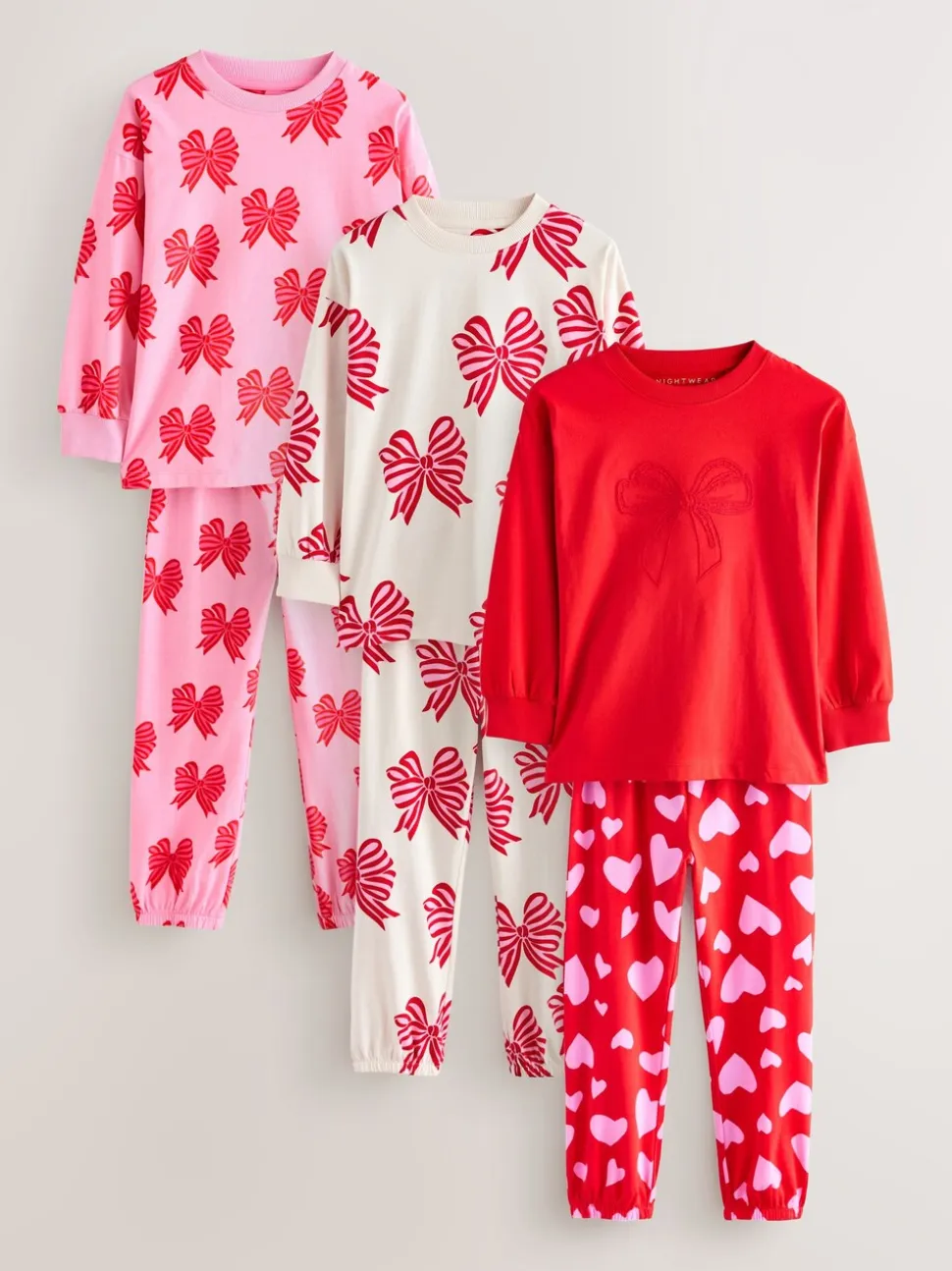 Rode strikken/hartjes - Verpakking van 3 pyjama's met joggingbroek (3-16 jr)