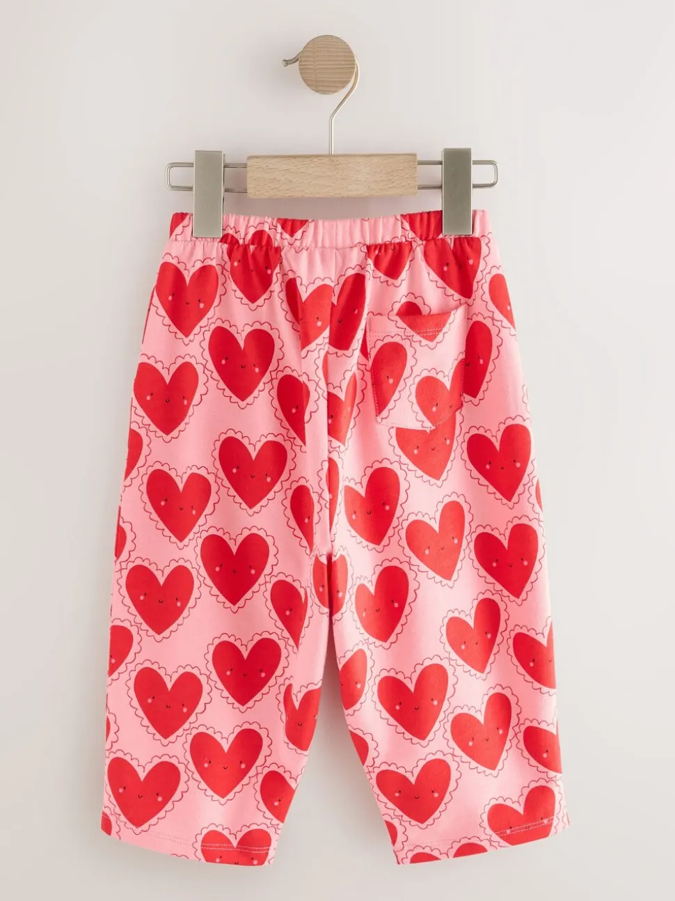 Rood met hartjesprint - Broek met structuur en wijde kortere pijpen (3mnd -7jr)
