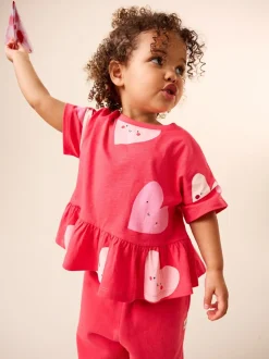 Rood met hartjesprint - T-shirt met peplum en korte mouwen (3mnd -7jr)