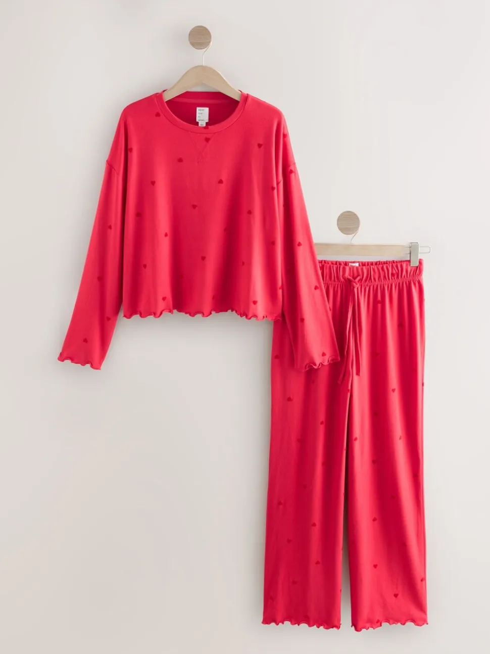 Rood met sterren - Zachte pyjama met lange mouwen en hartjesprint