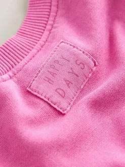 Roze dierenprint met hartjes - Set van sweatshirt en uitlopende legging (3mnd -7jr)