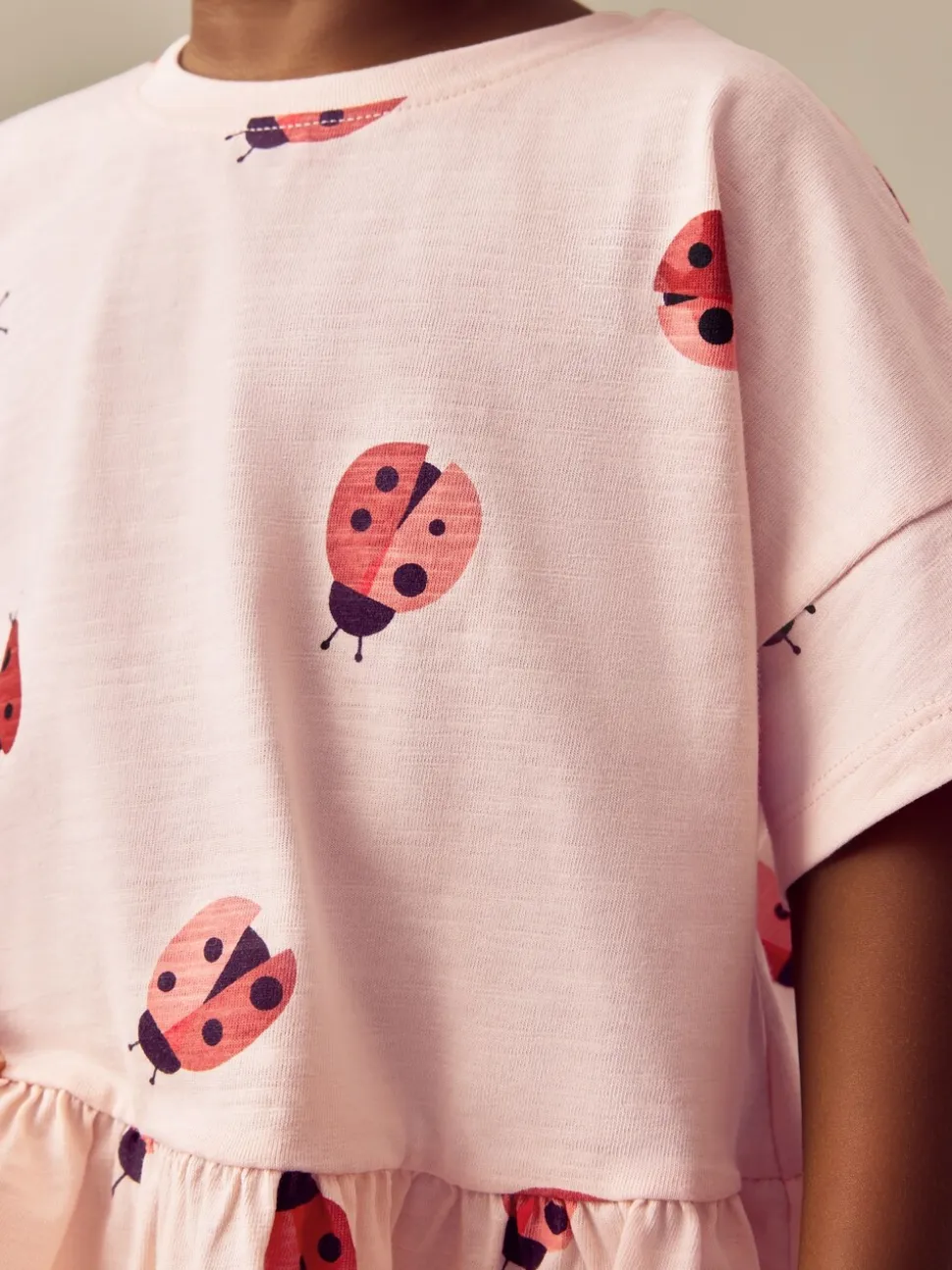 Roze lieveheersbeestje - T-shirt met peplum en korte mouwen (3mnd -7jr)