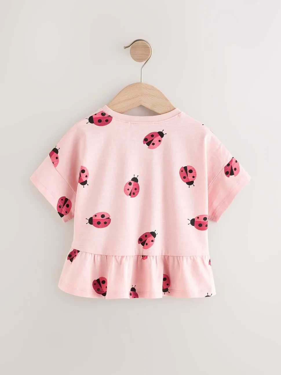 Roze lieveheersbeestje - T-shirt met peplum en korte mouwen (3mnd -7jr)