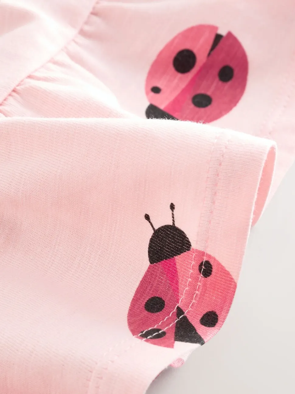 Roze lieveheersbeestje - T-shirt met peplum en korte mouwen (3mnd -7jr)