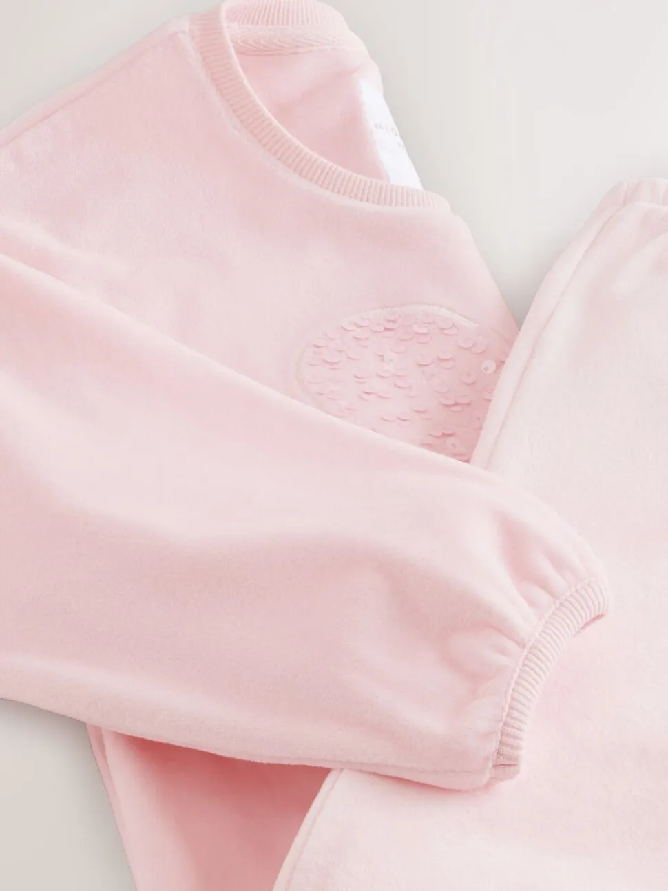 Roze met hart van lovertjes - Behaaglijke fleece pyjama (9 mnd-16 jr)