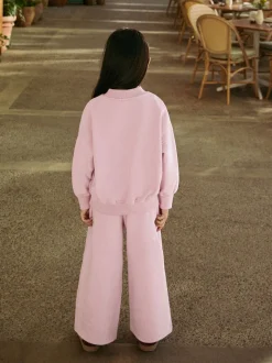 Roze met slogan - Set van sweatshirt en joggingbroek met wijde pijpen (3-16jr)