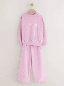 Roze met slogan - Set van sweatshirt en joggingbroek met wijde pijpen (3-16jr)