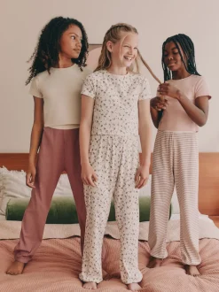 Roze met vrolijke bloemenprint - Verpakking van 3 pyjama's met joggingbroek (3-16 jr)