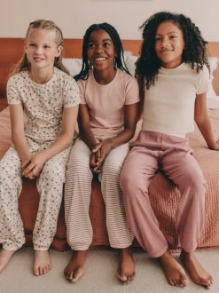 Roze met vrolijke bloemenprint - Verpakking van 3 pyjama's met joggingbroek (3-16 jr)