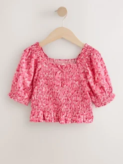Roze met vrolijke print - Gesmokte blouse (3-16jr)