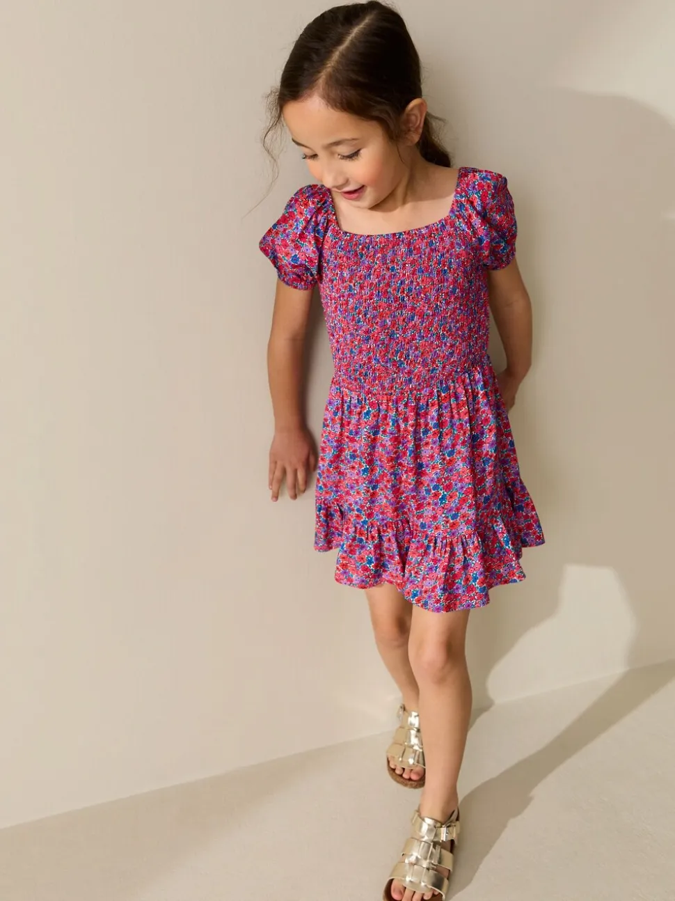 Roze met vrolijke print - Romper met smokwerk (3-16jr)
