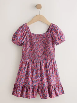 Roze met vrolijke print - Romper met smokwerk (3-16jr)