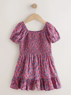 Roze met vrolijke print - Romper met smokwerk (3-16jr)