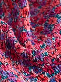 Roze met vrolijke print - Romper met smokwerk (3-16jr)