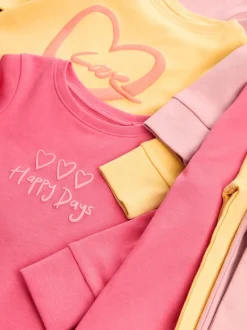 Roze/geel met slogan - Verpakking van 3 knusse pyjama's met print (9 mnd - 12 jr)