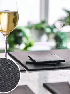 Set van 4 omkeerbare placemats en onderzetters van imitatieleer