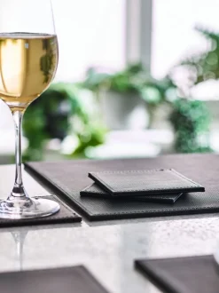 Set van 4 omkeerbare placemats en onderzetters van imitatieleer