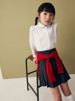 Wit - Schoolblouse met lange mouwen en gegolfde kantafwerking (3-14 jr)
