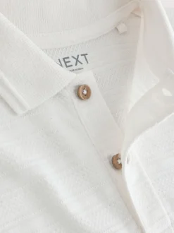 Wit - Set van poloshirt met textuur en korte mouwen en shorts (3 mnd - 7 jr)