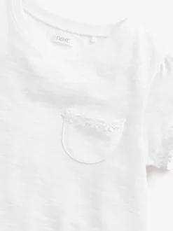 Wit - T-shirt met zakje en madeliefjesprint (1,5-16 jr)