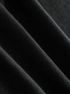 Zwart - Aansluitend - Gebreid poloshirt met hoog katoengehalte en korte mouwen