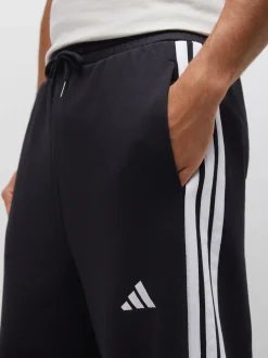 Zwart - adidas Essentials Three Stripes Fleece Wide Leg Trousers