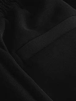 Zwart - Broek met wijde pijpen en elastiek in de achterkant