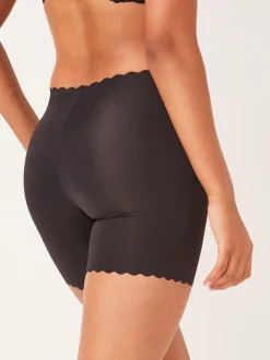 Zwart - Buik- en dijcorrigerende slip met geschulpte rand