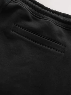 Zwart - Geborstelde jersey shorts met ritszakken