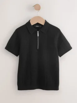 Zwart - Gebreid poloshirt met rits bij de hals (3-16jr)