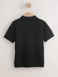 Zwart - Gebreid poloshirt met rits bij de hals (3-16jr)
