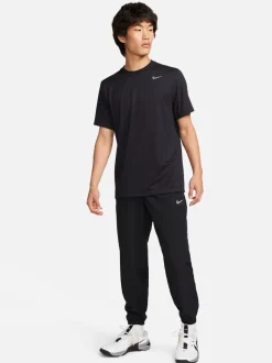 Zwart - Nike Dri-FIT Form trainingsbroek met taps toelopende pijpen