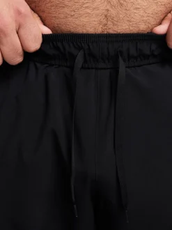Zwart - Nike Dri-FIT Form trainingsbroek met taps toelopende pijpen