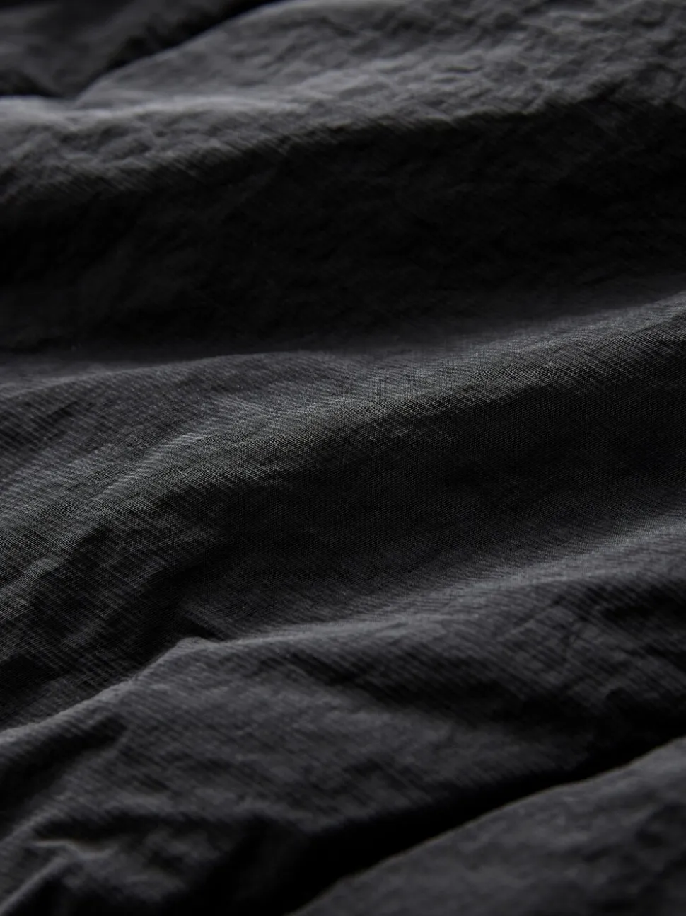 Zwart - Regenbestendige bodywarmer met capuchon en gebreide kraag